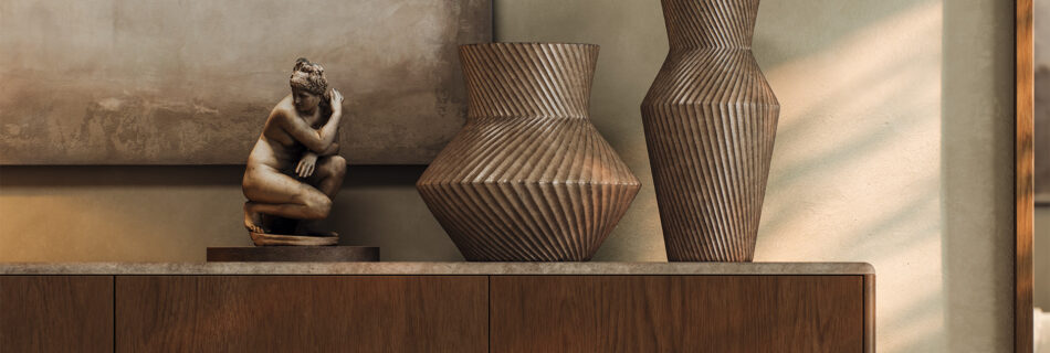 Contemporary interior styling with sculptural ceramic vases and figurative decor, warm light and minimalist luxury atmosphere